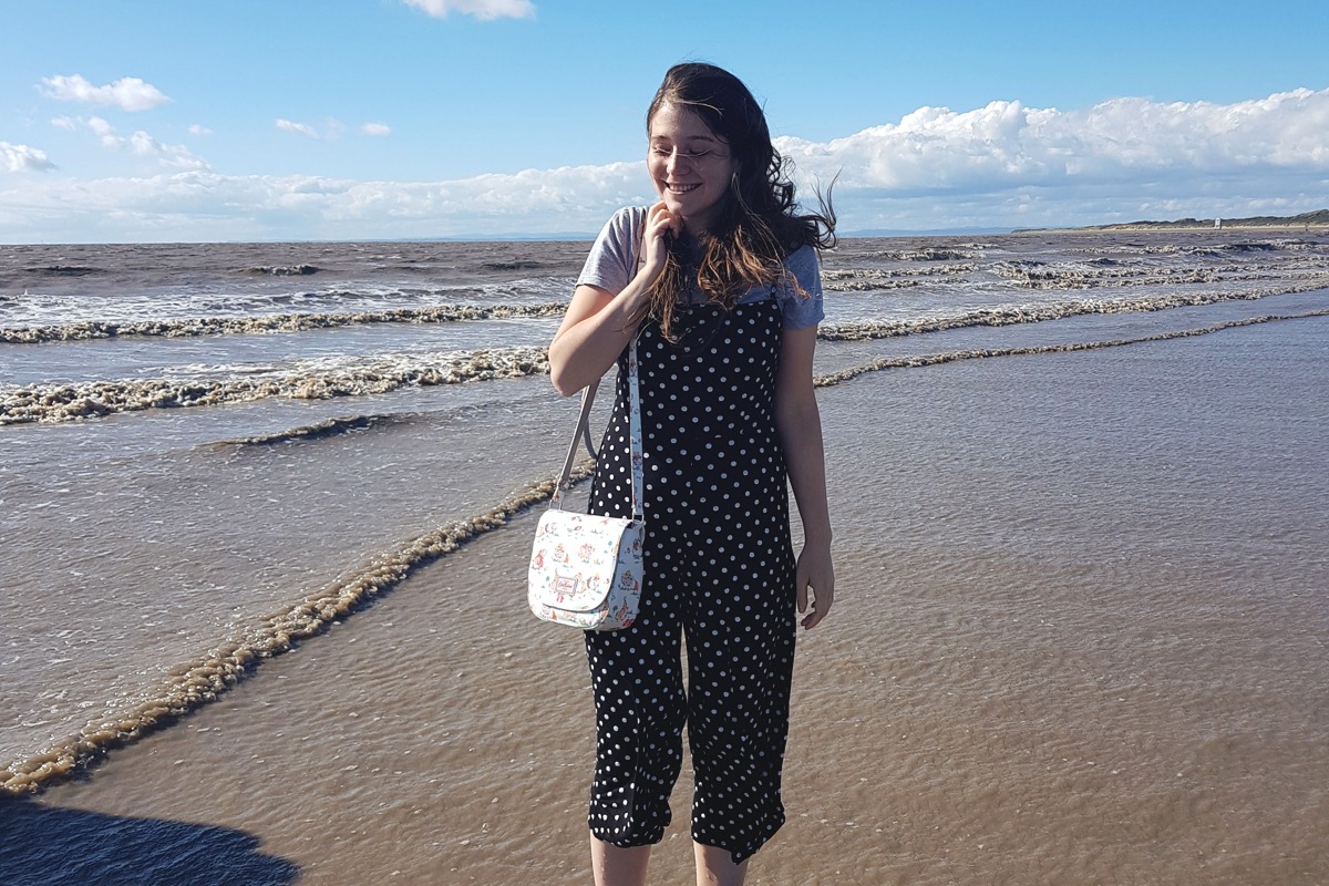 Sam on the beach in Burnham-on-sea wearing polka dot playsuit from Primark