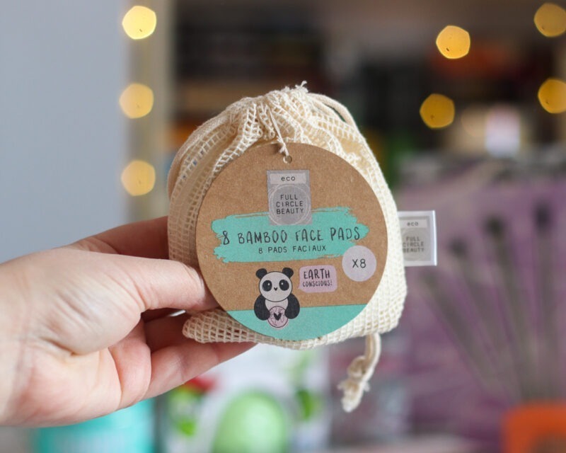 Sam is holding a net bag of Bamboo eco face pads